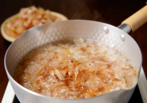 Bonito flakes are boiled in a small pot